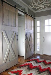 Love barn doors! I'd like to do something similar in our basement instead of window treatments for the sliding glass doors.