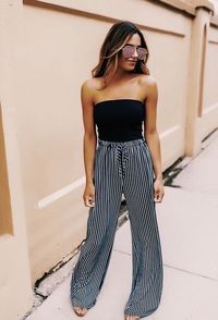 This black tube top is the perfect addition to the trendy striped pants.  #trend #trendy #black #tubetop #striped #pants #stripedpants #trendystyle #trends