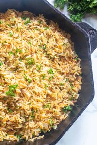 This Easy Homemade Rice Pilaf is a classic rice dish that's simple to make in one pot or skillet, is packed full of flavor, and is a favorite side dish in our house! #ricepilaf #recipe #easy #withorzo