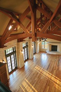 French doors, hardwood, and a great fireplace. And those trusses!