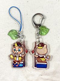 This is a double sided clear acrylic charm featuring CJ from Animal Crossing: New Horizons! -Charm measures approximately 1.5 in/3.8cm square; 3mm in thickness. -Composed from a single sheet of acrylic with the design printed on one side. The design is heat-pressed with a glossy coating which shouldn't scratch or chip easily. -Includes a small charm accessory of your choice. -Made from 100% recycled plastics! -Available with a lobster clasp keychain or cell phone strap. Available colors are pict