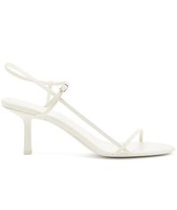 Find THE ROW Bare Leather Sandals on Editorialist. Lining: leather. Upper: lamb leather. Sole: leather insole and sole. Toe shape: almond open toe. Closure: buckle-fastening ankle strap. Designer color name: White. Made in Italy.