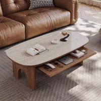 This coffee table is carefully crafted with a food-grade imported walnut finish that is natural and beautiful in texture and easy to clean and maintain. The 17.7-inch height design provides a comfortable reach, reducing the need to bend over when retrieving items. With its solid construction and minimalist "arc de Triomphe" design, this table is not only functional, but also has a modern and elegant expression in your living room. Orxva Galaxy Table Top Color: Beige | Orxva Galaxy Modern minimal