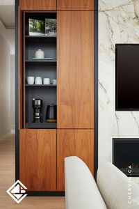 Check out this sleek coffee bar combining fixed shelves and a roll-out shelf. ☕✨ Featuring flat panel natural walnut pocket doors, tuck everything away when not in use and reveal a perfectly organized space for your daily caffeine fix...#CoffeeBar #PocketDoors #PocketDoor #CoffeeStation