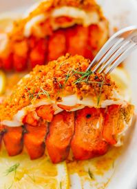 Learn how to cook lobster tails with lemon garlic butter and a parmesan bread crumb topping via broiling in the oven. broil lobster tails, steamed, pastry, how to boil, baked, recipe, dinner, romantic, valentine's day, frozen lobster tail, butterfly lobster tail, grilled, easy, how to cook, steamed