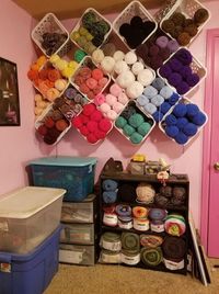 Install baskets on your wall like this and it looks like you have hexagon shelves for your yarn stash. Pretty clever! Visit our post for more yarn storage ideas and solutions!