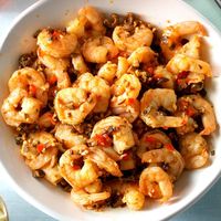 Delicate shrimp take on fabulous flavor when simmered in a chicken broth mixed with garlic and ripe olives. —Taste of Home Test Kitchen