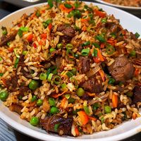 🍚 Indulge in the rich flavors of Oxtail Fried Rice! 🍖✨ #OxtailFriedRice #FlavorfulEats Oxtail Fried Rice Ingredients: Oxtail, cooked and shredded (1 lb) Cooked rice (4 cups) Garlic, minced (3 cloves) Onion, chopped (1) Carrots, diced (1 cup) Peas (1 cup) Soy sauce (3 tbsp) Oyster sauce (2 tbsp) Sesame oil (1 tbsp) Green onions, chopped (1/2 cup) Oil (for frying) Instructions: Heat oil in a large pan or wok over medium heat. Sauté garlic and onion until fragrant. Add carrots and peas, cook...