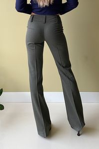 Extremely well fitted and cut with a lower waistline. These trousers made out of deadstock slinky suit fabric are incredibly soft on the skin whilst keeping you warm. Match with the Stitched Blouse , Shaped Tube Top, 4-Way Top Features Low to mid-waistline, see below for front rise for measurements Front zip-fly closure With large belt loops Material- Deadstock sourced: 50% wool, 48% polyamide, 2% elastane- Slinky lightweight fabric- Warm and soft on the skin Sizing - Fabric contains stretch- Me