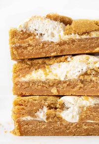 These Fluffernutter Bars are a delicious way to enjoy two of your favorite things - peanut butter and marshmallow! These bars start with the ingredients from my super popular fluffernutter cookies. Then, it's all about the marshmallow fluff (creme) placed in between the layers of dough. You can add them to your Christmas dessert charcuterie board!