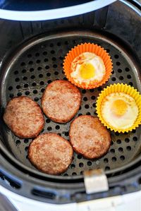 Sausage patties in air fryer PLUS eggs in the same basket makes the best air fryer breakfast ever!! Quick and grease drains away from meat. #airfryersausage #sausagepatties #airfryerbreakfast #airfryereggs