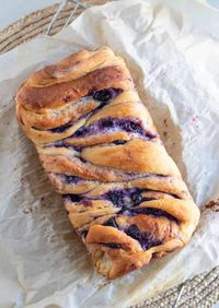 Buttery brioche dough rolled up with sweetened cream cheese and homemade blueberry preserves.