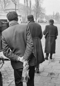 An anti-communist revolutionary holds a Molotov cocktail behind his back during the 1956 Hungarian Revolution.