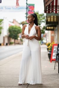 You'll be catching compliments in this beautiful white pleated pleated halter wide-leg jumpsuit! It is very comfortable and lightweight. Perfect for brunch. Pair it with your favorite sandals and a bracelet. True to size Jenaba is wearing a S Composition: 100 % polyester