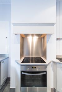 The built in oven fits neatly into chimney breast