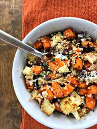 Roasted Sweet Potato & Cauliflower Power Bowl with black beans and quinoa. A bowl full of plant protein, fiber, and plenty of flavor!