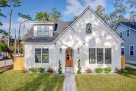 A traditional Tudor cottage with modern open vaulted living spaces. There are many options for garage placement inquire with us to see more. An incredible mudroom sets the stage for home arrival. The vaulted living space leads up the stairs to a loft that can be open to below or closed off as in the pictured home.