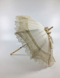 9" French Fashion Doll parasol. Recovered with cotton/silk woven stripe fabric and trimmed with  antique lace and silk floss tassels