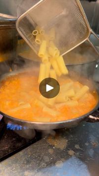 283K views · 5.7K reactions | The RIGATONI ALLA BUTTERA from Mark’s Off Madison in NYC always hits the spot!! 🍝🧀🔥🤤 Creamy, and delicious. #DEVOURPOWER | The RIGATONI ALLA BUTTERA from Mark’s Off Madison in NYC always hits the spot!! 🍝🧀🔥🤤 Creamy, and delicious. #DEVOURPOWER | By DevourPower | Pan gets tomato sauce, heavy
cream, peas, hot and sweet sausage and watch that color
change. In goes freshly boiled rigatoni. It all gets sauteed
together with a handful of Parmesan. Plated. Another round
of Parmesan and some chives. This is the rigatoni alabutera
from Marks Off Madison in New York City. Simple and
delicious.