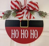 "What a great way to add some fun to your front door. Lovely Christmas door hanger  Ho ho ho , like Santa  This piece comes ready to hang , can also be used indoors. A great piece for any winter decor. These signs make a great statement to any home decor. They are made of 12 inch round or 18 inch . Comes with felt on back so it doesn't hurt the doors. They are are not heavy and look great hanging on a wall/door or even propped on an easel for display on a table/shelf area. Can be used on front d