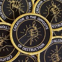 When everything else is falling apart, let's combat it and create something. Patch by Tender Ghost. 3 inches. Iron-on backing, metallic gold thread.