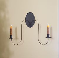 Introducing the Hope Tin Sconce. Crafted with durable tin material, this sconce adds a touch of elegance to any room. With its sleek design and versatile functionality, it provides ambiance and enhances the aesthetic of your space. A must-have for those seeking both practicality and style. Sconce Reflector 9" Long x 5.5" Wide 23" Arm Span Arms swoop down from the very bottom of the reflector 12" Candles not included Handcrafted in the USA