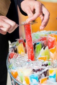 A popsicle bar with Otter Pops and bubbly to cool down at summer weddings: | 23 Brilliant Ideas For Wedding Snacks