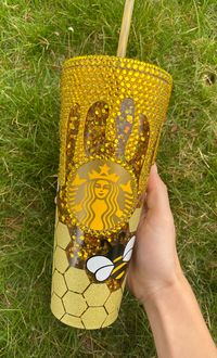 This Starbucks Tumbler is decorated with Rhinestone Honey Drips and Vinyl Bees and Honeycomb with moving gold glitter floating between the tumbler walls.  Cup Chain Upgrade: Large=  approximately 3.5 inches or 28 links Medium= approximately 3 inches or 24 links Small= approximately 2.5 inches or 20 links  This length does not include length of the Claw Clip Cup Chain Upgrades do not come with charms.  This cup is for cold beverages only and is not dishwasher or microwave safe. Hand wash only. Do not soak.