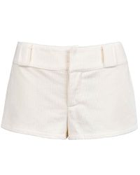 Mini corduroy shorts with wide waistband and zipper closure at front.Made from 100% Cotton. Model is 5"9 and wears size S.