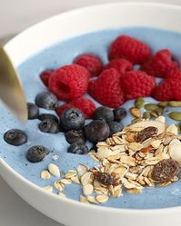 Smoothie bowl healthy breakfast with blue spirulina, strawberry, banana and blueberry, desserts, cake recipes