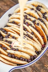 Blueberry Pancake Casserole Recipe - this is seriously delicious! Frozen pancakes, blueberries eggs, heavy cream, milk, vanilla, brown sugar, flour, oats, and melted butter. Can assemble the casserole ahead of time and refrigerate it before baking. Great for an easy weekday or weekend breakfast, brunch, overnight guests, and holiday mornings!