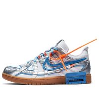 The Nike OFF-WHITE x Air Rubber Dunk is a special edition shoe that was created in collaboration with Virgil Abloh’s luxury streetwear brand. The shoe is a reinterpretation of the classic low-top basketball sneaker, and features design elements borrowed from the world of lifestyle running shoes. The upper part of the shoe is made from white mesh, with blue accents and metallic silver overlays. The bottom part of the shoe features a gum rubber cupsole with visible Air cushioning. Virgil Abloh’s personal stamp can be seen on the orange tab on the outlined Swoosh, and on the Helvetica text on the medial side panel. (SNKR/Skate/Unisex/Low Top/Crossover/Europe Limited)