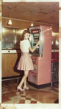 Immerse yourself in the nostalgia of the 1950s with this delightful scene of a stylish lady choosing her favorite melody from a classic jukebox. Perfect for those who love a blend of fashion and music from yesteryear! 🎶👠 Pin this to your Vintage Lifestyle board!