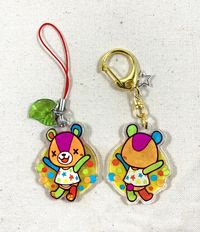 This is a double sided clear acrylic charm featuring Stitches from Animal Crossing! -Charm measures approximately 1.5 in/3.8cm square; 3mm in thickness. -Composed from a single sheet of acrylic with the design printed on one side. The design is heat-pressed with a glossy coating which shouldn't scratch or chip easily. -Includes a small charm accessory of your choice. -Made from 100% recycled plastics! -Available with a lobster clasp keychain or cell phone strap. Available colors are pictured. Pl