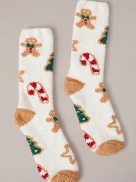 Cozy up with these gingerbread print socks. Made with soft, warm materials, these socks feature a classic holiday cookie pattern for a touch of winter charm.