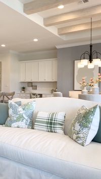 Coastal Farmhouse Decor includes light wood beams, neutral paint, prints, patterns and white kitchen. #coastaldesign #farmhousechic