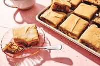 A dense, moist, flavorful apple cake topped with fudge-like brown sugar frosting.