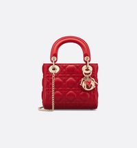 Part Of The Dioramour Capsule, The Lady Dior Bag Embodies The House's Vision Of Elegance And Beauty. Sleek And Refined, The Timeless Design Is Crafted In Red Lambskin With Cannage Stitching, Creating The Instantly Recognizable Quilted Texture. The Silhouette Is Elevated By Pale Gold-finish Metal D.i.o.r. Charms And A Red Enamel Heart Charm. The Miniature Style Has A Thin, Removable Chain Strap, Allowing It To Be Carried By Hand Or Worn Crossbody. It Will Coordinate Well With Other Dioramour Crea