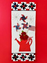 Celebrate the 4th of July with this darling wall hanging. Finished size: 14" x 35"  #4thofjuly #july #decorations #homedecor #sewing #appliquesewing #blue