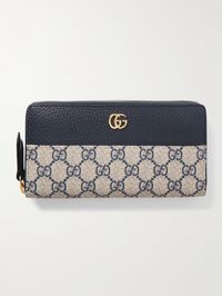 Gucci's sleek and streamlined wallet is part of the Italian house's signature 'Marmont' collection. Made from 'GG Supreme' coated-canvas in a '70s palette, it's detailed with textured-leather and the iconic logo plaque. Slip it into a coordinating tote.