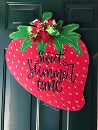 "Summer door hanger / Strawberry door hanger / Strawberry decor / Sweet summer time door hanger / summer door decor / summer decorations / front door décor / summer yard art / welcome door hangers / colorful door hanger / strawberry yard art This strawberry door hanger is APX 23\" x 19\". Sizes will vary slightly. Ribbon color may vary. It comes with a metal wire already attached for easy hanging (see all pictures). These strawberries are cut from plywood. There will be imperfections, or marking