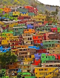 Port-au-Prince is home to some of the most colorful homes around. Haiti Travel Destinations Honeymoon Backpack Backpacking Vacation Budget Bucket List Photography Wanderlust #travel #honeymoon #vacation #backpacking #budgettravel #offthebeatenpath #bucketlist #wanderlust #Haiti #exploreHaiti #visitHaiti #TravelHaiti