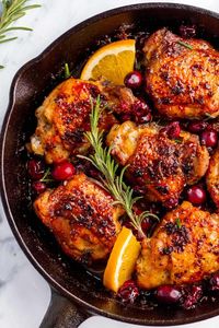 This cranberry chicken is chicken thighs roasted with fresh cranberries, orange juice and seasonings.