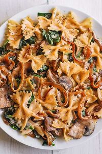 Farfalle with Spinach, Mushrooms, Caramelized Onions. This simple meatless Italian dinner is pure comfort food! The bow-tie shaped pasta is perfectly matched with rich and buttery Parmesan sauce!