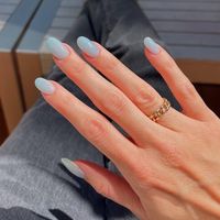 Blueberry milk nail ideas incorporate soft blue and creamy white shades for a sweet and soothing manicure.