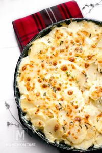 Munchkin Time's Cheesy Scalloped Potatoes Recipe, it is so creamy and good!  #scallopedpotatoes #holidaysidedish #christmasrecipe