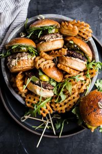 These juicy beef sliders—slathered with a homemade bright and lemony sun-dried tomato mayo, spicy pickles, and fresh arugula—prove that bigger doesn’t always equal better.