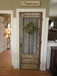 Use an old rustic door as a pantry door!  I love this...