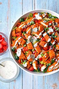 This Low FODMAP Air Fryer Buffalo Chicken Salad features crispy chicken tenders dipped in a homemade, buffalo-style hot sauce, placed on a crisp salad and topped with a cool and creamy low FODMAP homemade ranch dressing. Low FODMAP at 1 serving, Paleo, Whole30, lactose-free and grain-free. #goodnomshoney #lowfodmap #airfyer #airfryerrecipes #buffalochickensalad #buffalochicken #chickentenders #paleo #whole30 #salad #saladrecipes #lunch #dinner