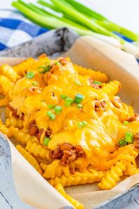 With a homemade meat sauce and slathered in cheese, these Chili Cheese Fries are the appetizer of your dreams. The perfect game day, movie night or munchie food.